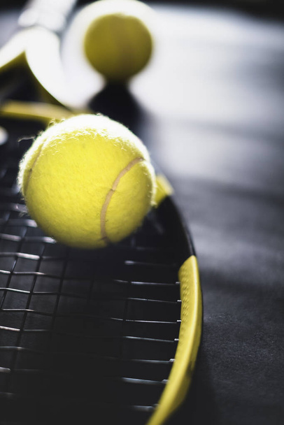 sport fitness equipment. Top view tennis racquet balls and silver cup - Fotó, kép