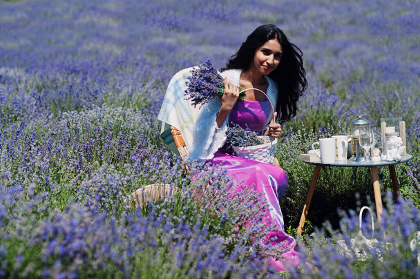 Beautiful indian girl wear saree india traditional dress sitting in purple lavender field with decor. - Photo, Image