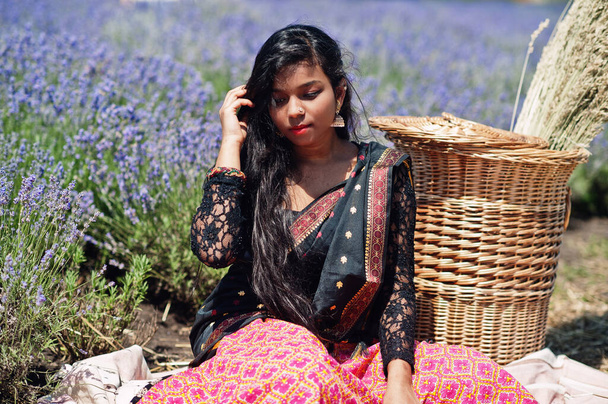 Beautiful indian girl wear saree india traditional dress in purple lavender field.  - Fotoğraf, Görsel