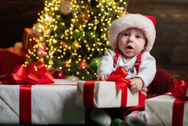 Funny attractive baby in Christmas costume. Kids New Year. - Zdjęcie, obraz