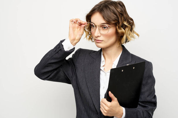 Woman in business suit finances work documents glasses hairstyle - Zdjęcie, obraz