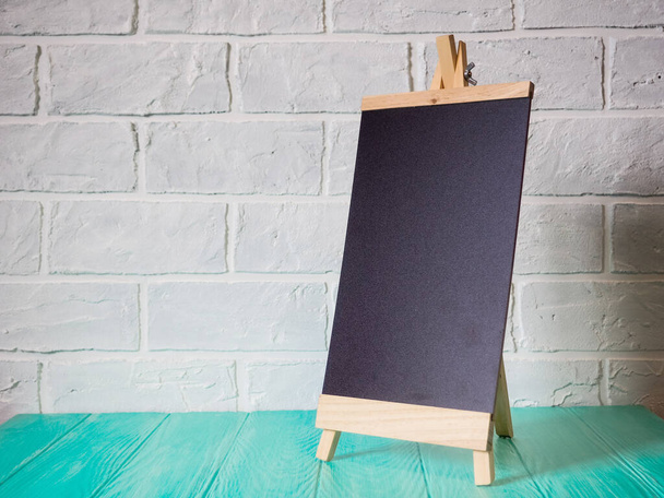 Chalkboard in wooden frame. Empty stand mockup menu frame. - Fotó, kép