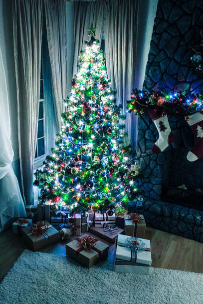 Christmas and New Year tree in modern interior design - 写真・画像