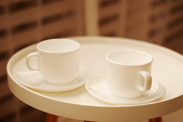 two white cups for tea drinking on a white tray - Photo, Image