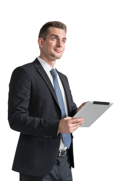 Isolated portrait of smiling young businessman using tablet computer. Concept of technology and internet - Foto, immagini