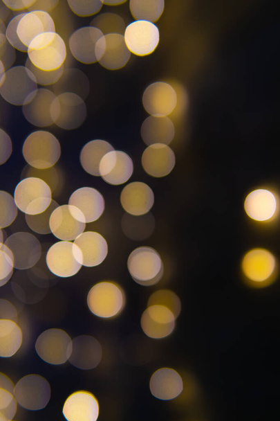 Background of New Year's garlands like stars. Christmas atmosphere with garlands in defocus. - Photo, Image