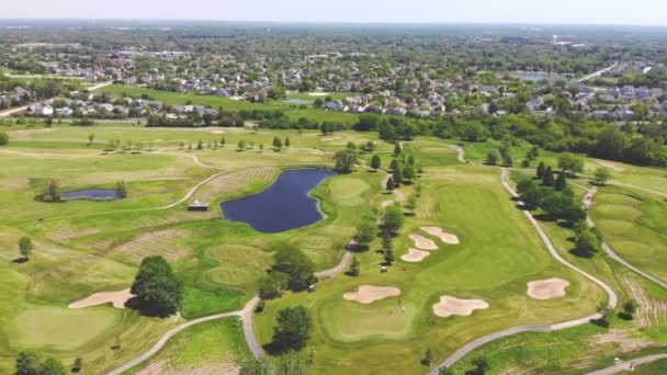 Aerial View from the top n of the golf course. People and cars on a golf course from a height. - Footage, Video