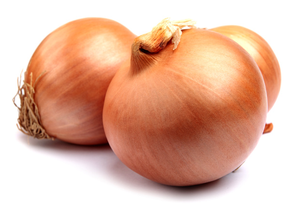 Three golden bulbs of ripe onions are isolated on a white background. - Photo, Image