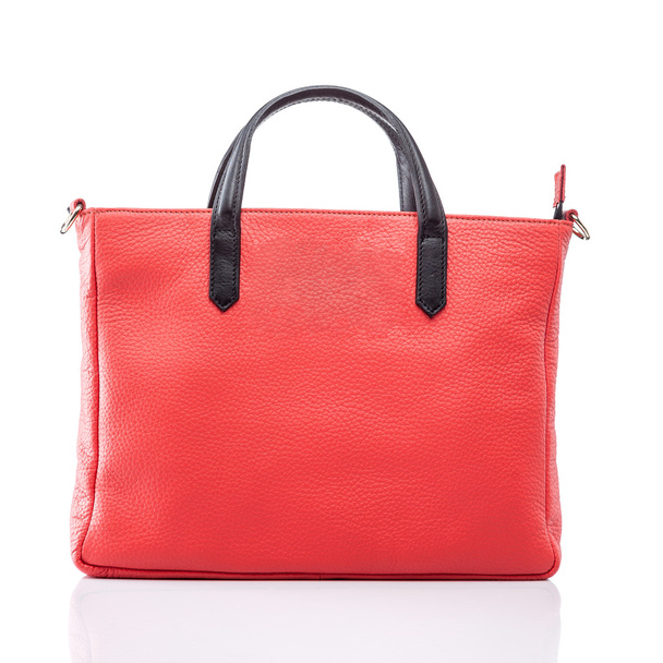 女性の赤い革製のハンドバッグ - 写真・画像