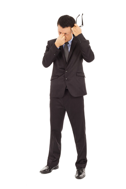 businessman rubbing his eyes and holding glasses - Photo, Image