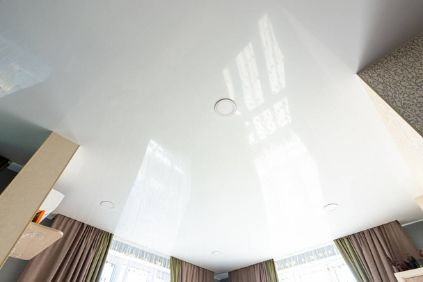 Classic white glossy ceiling with recessed spotlights - Photo, Image