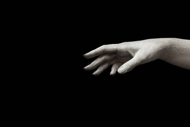 A beautiful womans hand reaches for something - Φωτογραφία, εικόνα