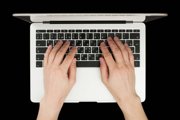 Top view of businessman hands busy using laptop at black office des - Foto, Imagem