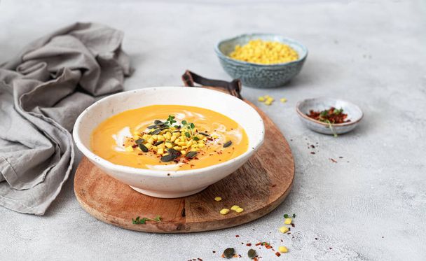 Pumpkin and vegetables cream soup with pumpkin seeds and crackers - Photo, Image