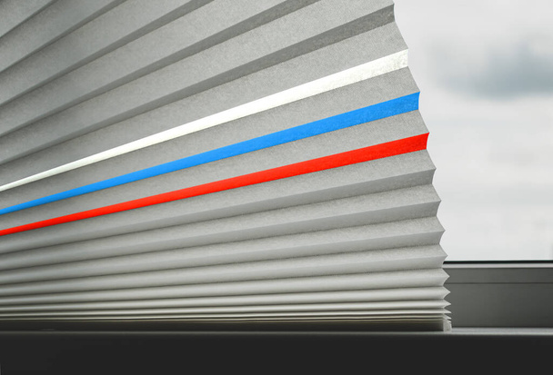 Fragment of paper blinds for a white plastic window with the image of the Russian flag - Zdjęcie, obraz