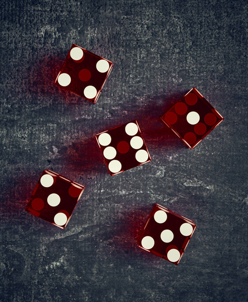 Stylized playing dice on dark background, shallow depth of field, top view, close-up - Foto, Bild