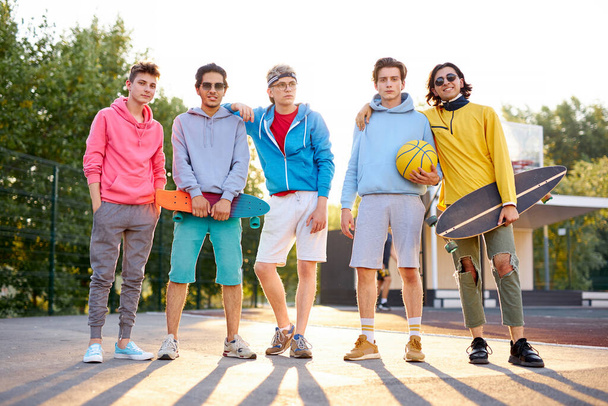 diverse young city boys are ready to play basketball together - Фото, зображення