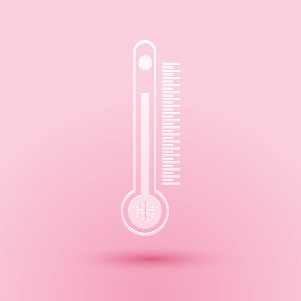 Papír vágott hőmérő skála mérő hő és hideg, a nap és a hópelyhek ikon elszigetelt rózsaszín alapon. Papírművészeti stílus. Vektor. - Vektor, kép