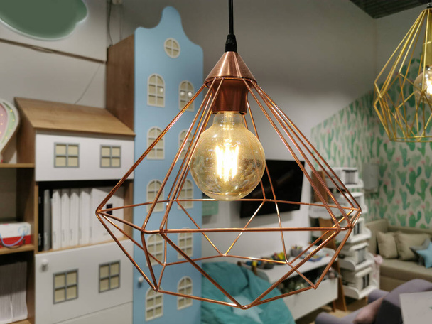 retro copper hanging lamp with orange light bulb. - Photo, Image