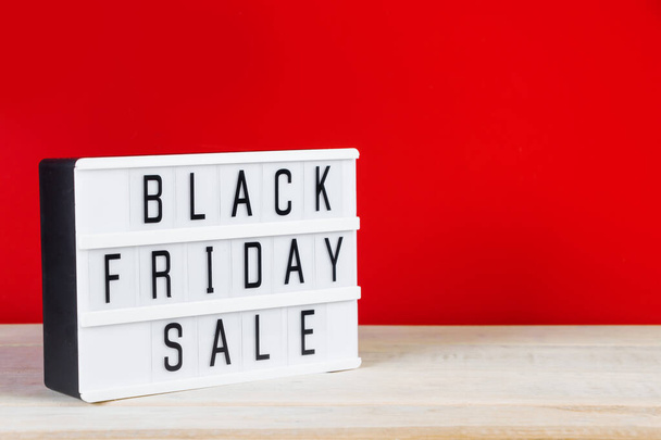 Black Friday concept. Sign on a red background. Place for text. - Φωτογραφία, εικόνα