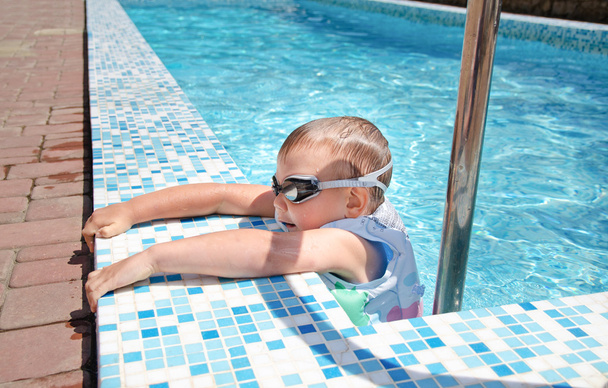 Small boy clambering out swimming pool - Photo, Image