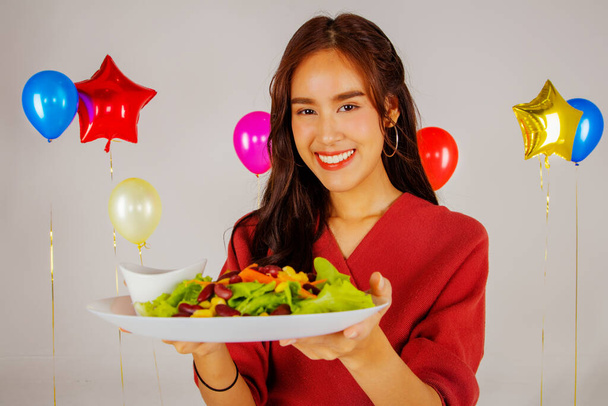 Portrait asian women eat healthy vegetable salad tray at party : She invites to eat healthy food - Photo, Image