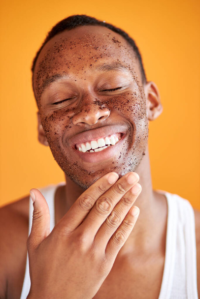 happy black male with mud healthy scrub on face - Фото, изображение