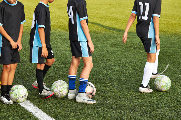 young caucasian players on soccer training - Fotó, kép
