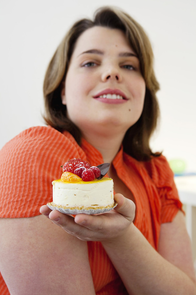 WOMAN EATING SWEETS - Photo, Image