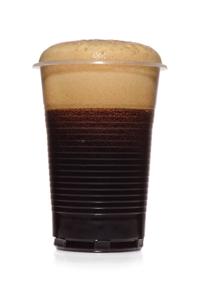 Black stout dark beer in a plastic disposable cup to go isolated on white background. - Photo, Image