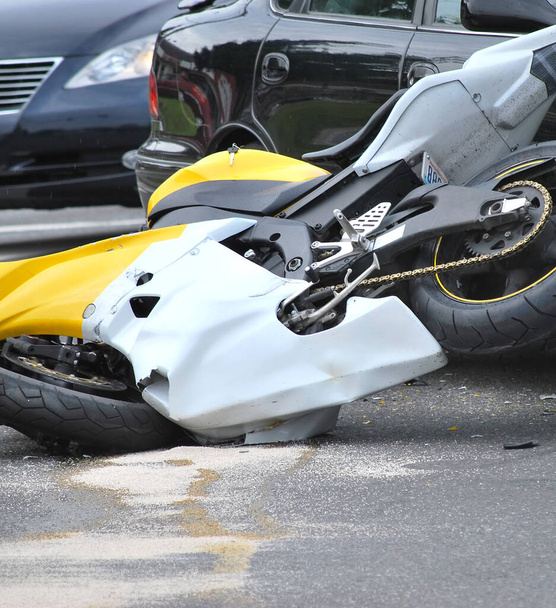 Car and motorcycle accident caused by a drunk driver speeding. - Photo, Image