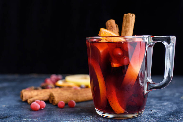 Mulled red wine with spices. Christmas decoration. Grey background. Copy space. New years content 2021 - Photo, Image