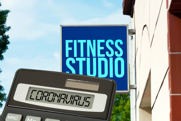 Fitness studio, calculator and corona virus - Photo, Image