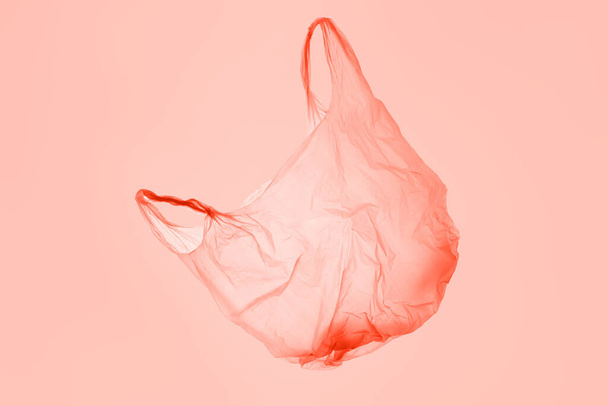 Transparent pink plastic bag in pink toned light - Φωτογραφία, εικόνα