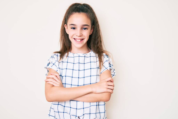 Cute hispanic child girl wearing casual clothes happy face smiling with crossed arms looking at the camera. positive person.  - Fotografie, Obrázek