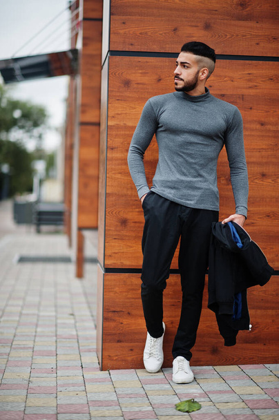 Portrait of stylish arab beard man wear grey turtleneck and black jaket. Arabian model guy. - Fotografie, Obrázek