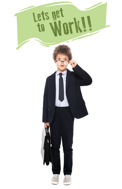 surprised boy in suit fixing glasses and holding briefcase near lets get to work lettering on white - Foto, afbeelding
