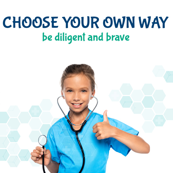 child in costume of doctor holding stethoscope while showing thumb up near choose your own way be diligent and brave lettering on white  - Photo, Image