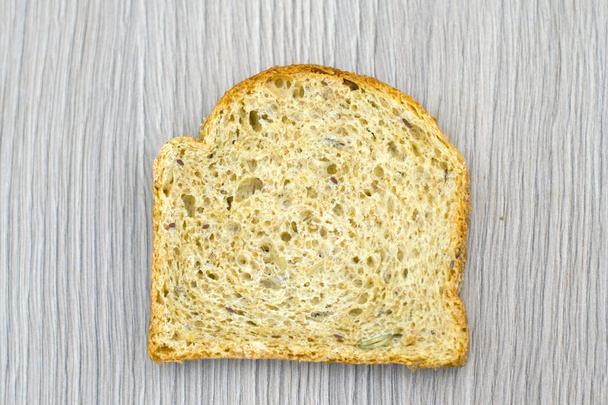 Fresh Tasty Bread on Woody Background - Photo, Image