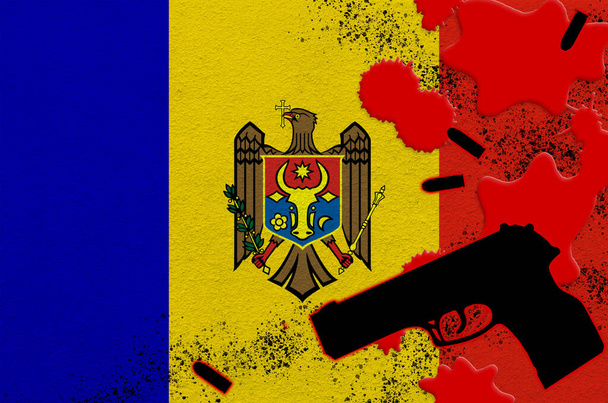 Moldova flag and black firearm in red blood. Concept for terror attack or military operations with lethal outcome. Dangerous handgun usage - Photo, Image