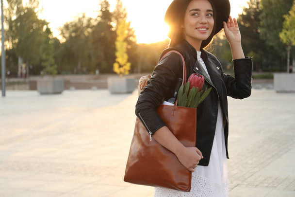 Woman with stylish leather shopper bag on city street - Valokuva, kuva
