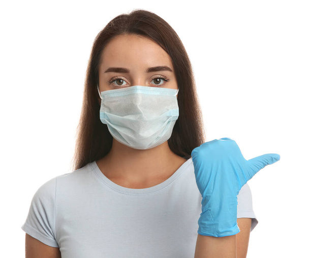 Woman in protective face mask and medical gloves on white background - Fotó, kép
