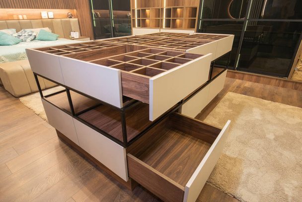 Interior design decor furnishing of luxury show home bedroom showing wooden closet drawer furniture - Foto, Imagen