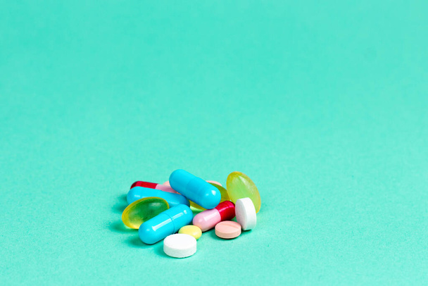 Multi-colored medical pills or pills on a solid background. - Φωτογραφία, εικόνα