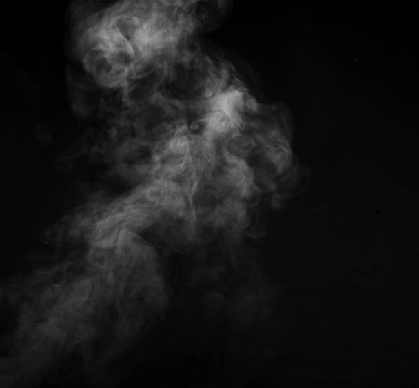 Smoke fragments on a black background. Abstract background, design element, for overlay on pictures. - Foto, Imagen