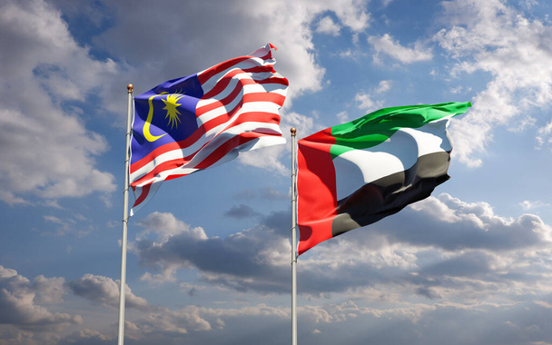 Beaux drapeaux d'État nationaux de la Malaisie et des Émirats arabes unis ensemble au fond du ciel. Concept d'illustration 3D. - Photo, image