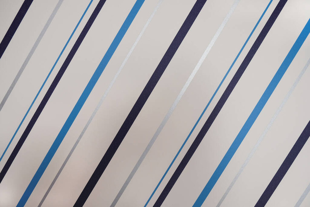 Abstract background, copy space, modern striped wallpaper, close-up. Texture. Blue, black, silver stripes on a white background. Renovation concept, housing renovation, interior design. Horizontal. - Φωτογραφία, εικόνα