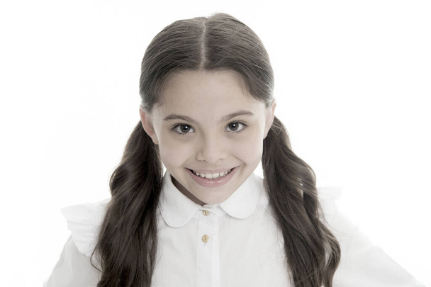 Hairdresser salon services for little girl. Little girl smiling with long hair isolated on white. Happy child with adorable smile. Perfect hairstyle. Beauty salon. Skincare and hair care - Zdjęcie, obraz