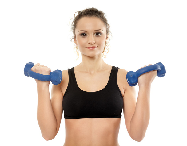 Woman working with dumbbells - Photo, Image
