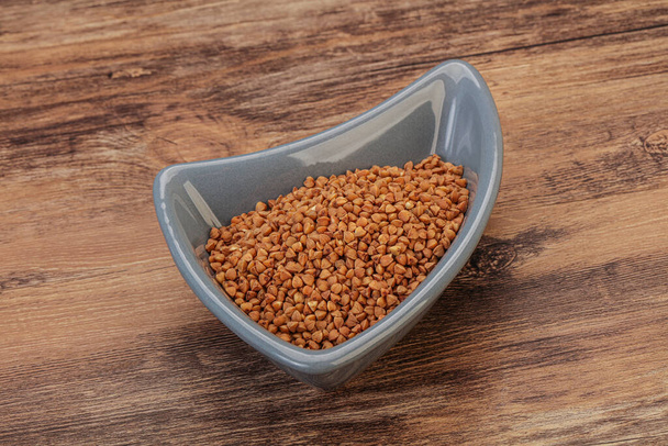 Dietético Cereales de bukwheat crudo en el bowl   - Foto, imagen